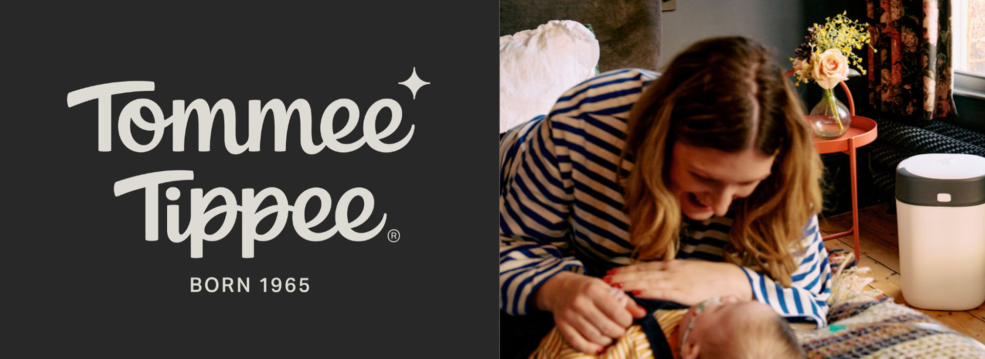 Tommee Tippee-logo og kvinne med baby i stripete genser.